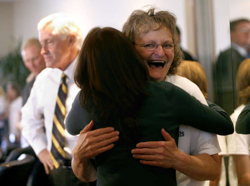 Debra Brown hugs Katie Monroe, Rocky Mountain Innocence Center Executive Director, after a press conference at the Snell and Wilmer office in Salt Lake City on Monday, May. 9, 2011. Brown was just released after serving 17 years in prison for a wrongful conviction.