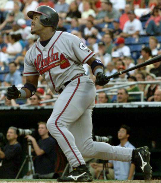 Atlanta Braves' Brian Jordan watches his three-run home run off of Philadelphia Phillies pitcher Omar Daal on June 25, 2001. (AP Photo/Rusty Kennedy)