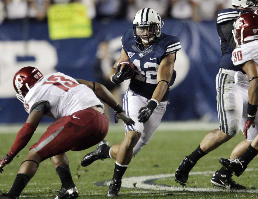 Brigham Young Cougars running back Michael Alisa (42) runs against Washington State Cougars linebacker Darryl Monroe (13) in Provo Thursday, Aug. 30, 2012. (Jeffrey D. Allred, Deseret News)