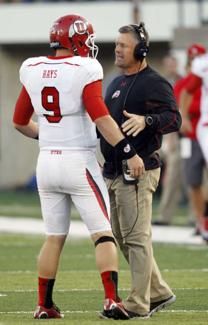 Utah quarterback Jon Hays (9) talks with head coach Kyle Whittingham during the Utah State game in Logan. (Photo: Deseret News)