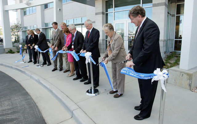 The ribbon is cut at Intermountain Healthcare's Kem C. Gardner Supply Chain Center, a highly automated, 327,000-square-foot medical distribution center and warehouse in Midvale, on Wednesday, Sept. 12, 2012.