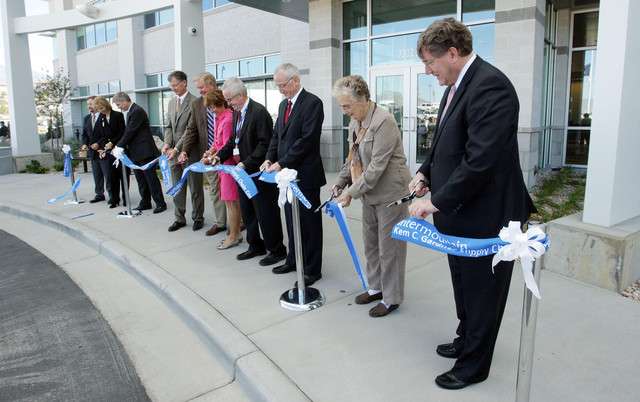 The ribbon is cut at Intermountain Healthcare's Kem C. Gardner Supply Chain Center, a highly automated, 327,000-square-foot medical distribution center and warehouse in Midvale, on Wednesday, Sept. 12, 2012.