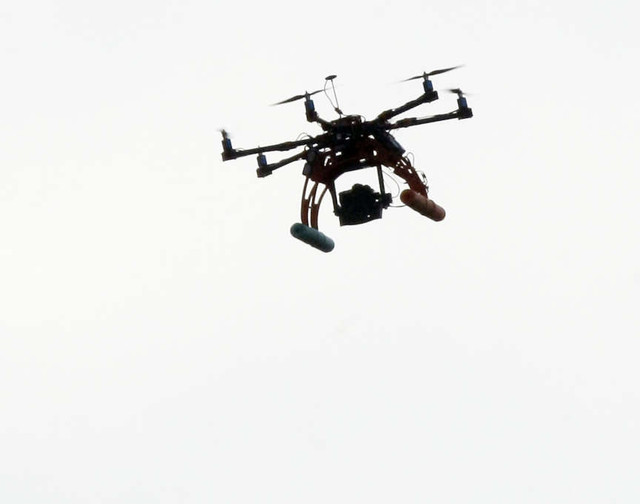 A remote controlled drone is used by Unified police to get an aerial view of the area. Residents in Millcreek near Olumpic Way and Del Mar Dr. are evacuated by Unified Police as they work a SWAT situation Sunday, Sept. 23, 2012. A man that has rigged his home and yard with what police think are explosives is hold up inside his home.