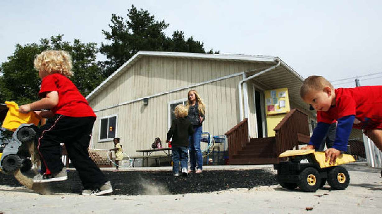 Jason Matterfis front left, and Vladik Talker race trucks at the Wee Care Center at Utah Valley University in Orem on Sept. 24, 2012. The Utah Legislature gave final passage on Thursday to two bills aimed at helping families and children in the state.