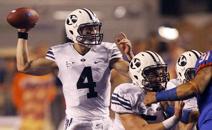 BYU quarterback throws a pass against Boise State.