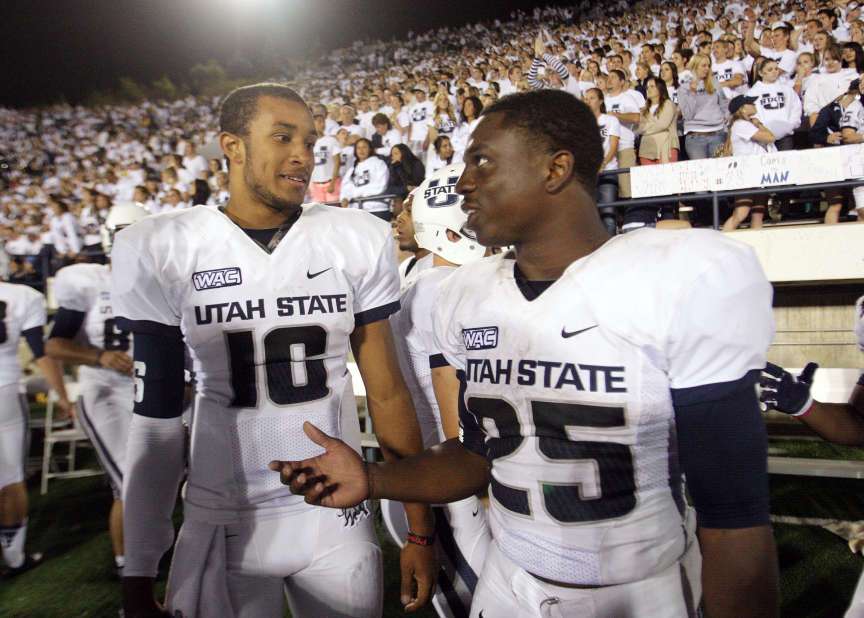 Utah State Aggies quarterback Chuckie Keeton (16) and Utah State Aggies running back Kerwynn Williams (25) talk near the end of the game in Logan Saturday, Sept. 29, 2012. (Submission date: 09/29/2012)