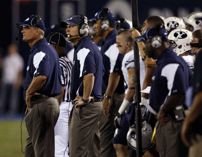 BYU coaches and bench look on near the end of the game which ended in a loss to USU in Logan, Utah, Friday, Oct. 1, 2010. (Ravell Call, Deseret News)