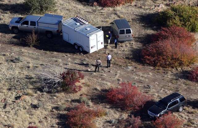 Investigators look over a scene Tuesday, Oct. 16, 2012, where Corey Dee Kanosh, 35, who police say led them on a chase in a stolen vehicle, was shot and killed by a Millard County sheriff's deputy Oct. 15 following an altercation with the officer. (Photo: Ravell Call, Deseret News)