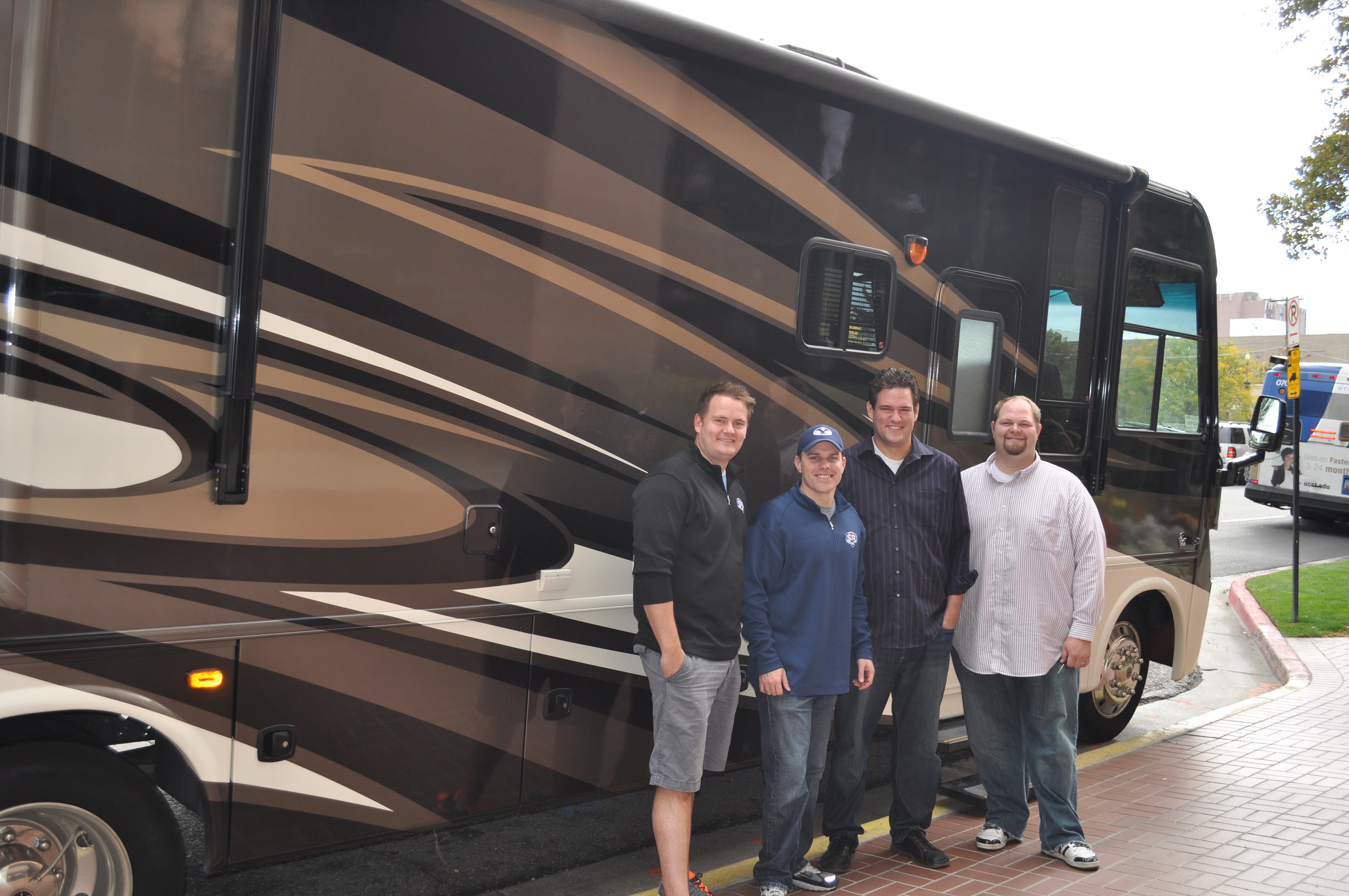 Left to right: John, Jason, Dave, Alex in fron of 1/3 of the RV