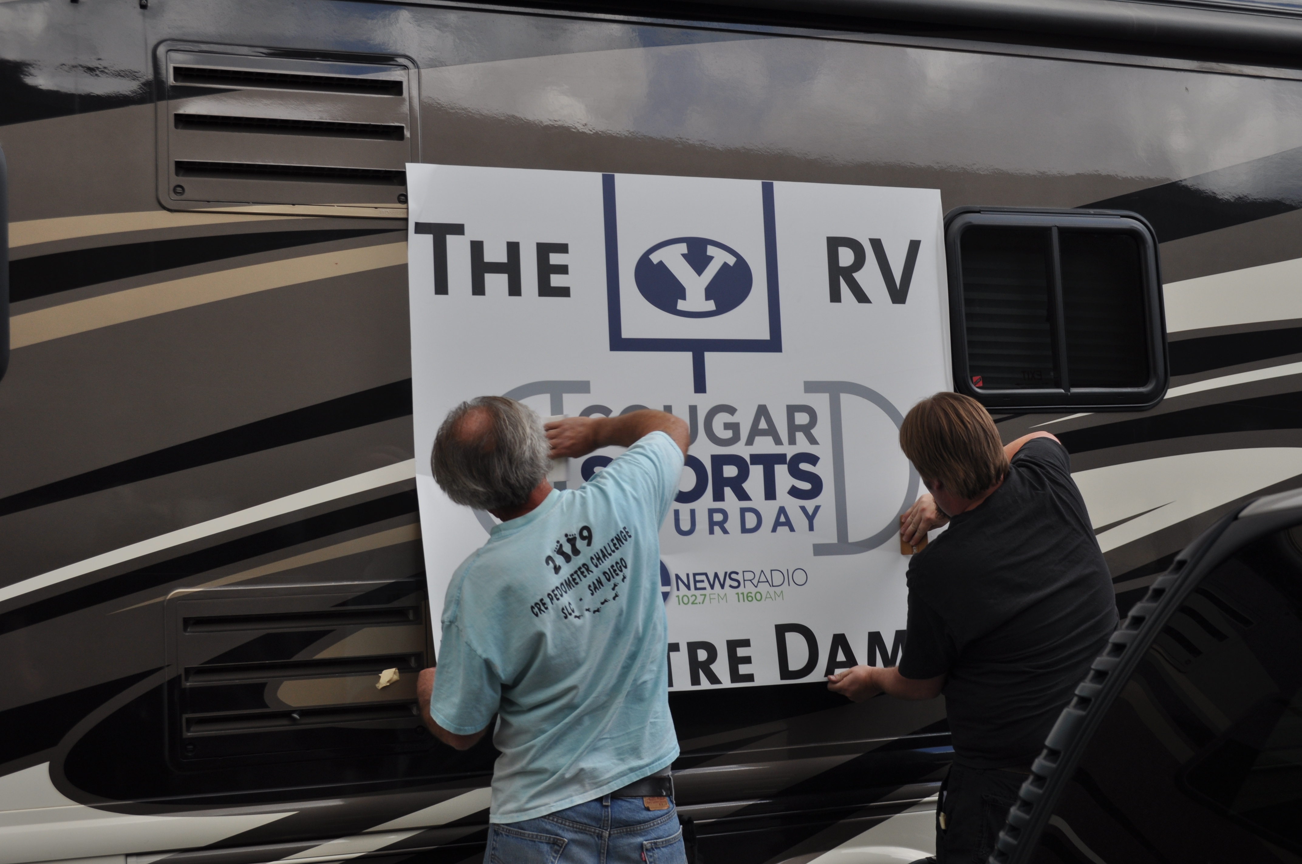 Some awesome guys putting on our awesome banner