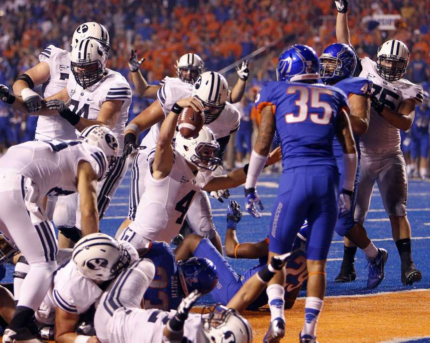 Taysom Hill (4) celebrates scoring BYU's only touchdown against Boise State (Ravell Call, Deseret News)