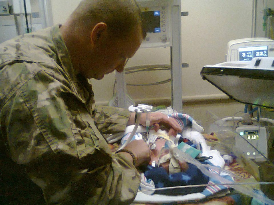Dad returns from war for baby delivered from comatose mom