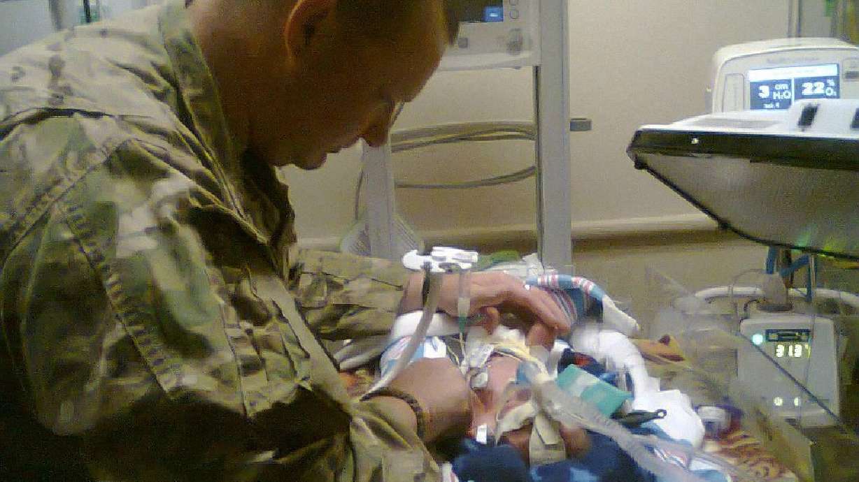 Dad returns from war for baby delivered from comatose mom