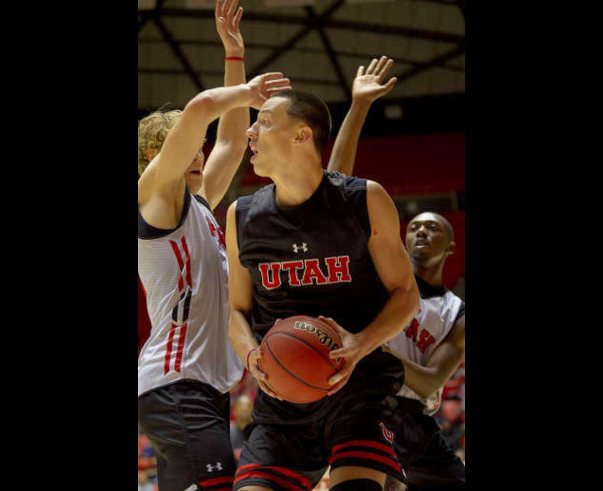 Jason Washburn posts up during the "Night with the Runnin' Utes" (Ben Brewer, Deseret News)