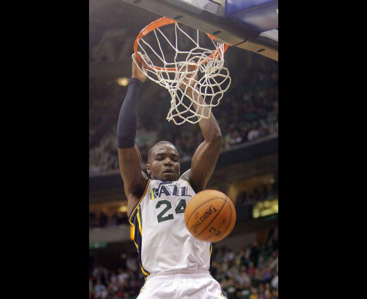 Utah Jazz power forward Paul Millsap (24) slams on Phoenix during NBA action in Salt Lake City Saturday, Nov. 10, 2012. The Jazz won 94-81.
