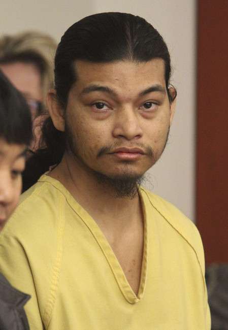 Esar Met sits next to his interpreter at his preliminary hearing in Judge William Barrett's 3rd District Court in Salt Lake City on Thursday, Nov. 15, 2012. Esar Met is accused of killing 7-year-old Hser Ner Moo in 2008. (Photo: Rick Egan, POOL photo)