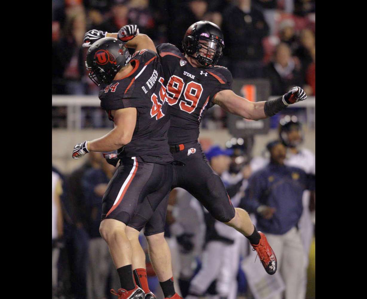 Utah Utes defensive end Joe Kruger (99) celebrates his quarterback sack with his brotherUtah Utes defensive tackle Dave Kruger (44) in Salt Lake City Saturday, Oct. 27, 2012. (Jeffrey D. Allred, Deseret News)