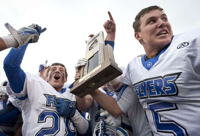 Dixie Flyers celebrate their victory in the Utah State High School 3A Football championship game between Spanish Fork and Dixie Friday, Nov. 16, 2012. (Ben Brewer, Deseret News)