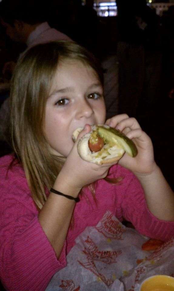 Sam Gordon enjoying a hot dog after appearing on "Fox and Friends"