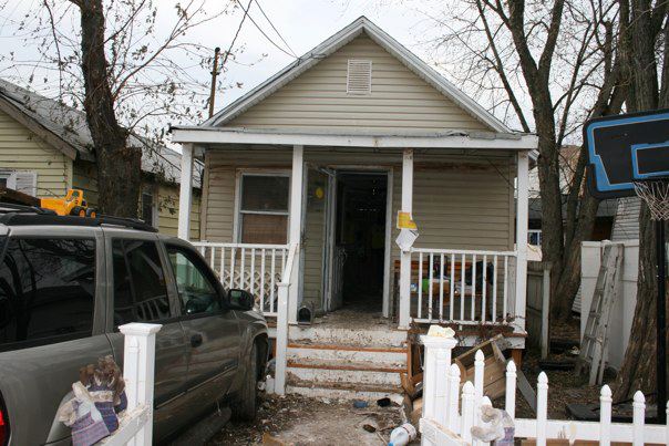 Robert's home on Staten Island. The water line is visible above the door.