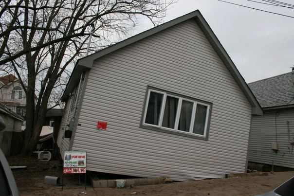 The house next door to Robert's that fell off its foundation.