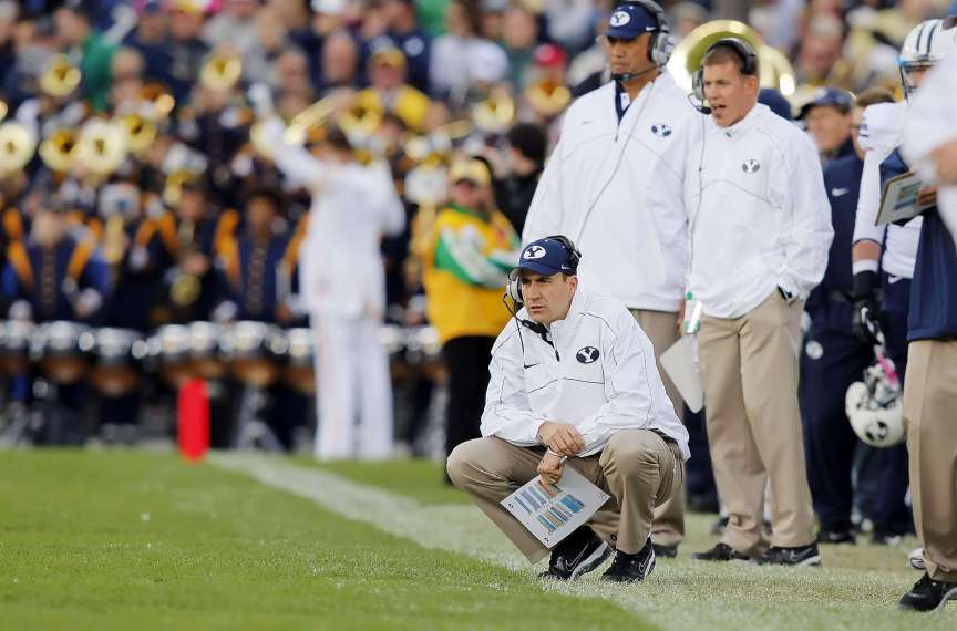Brandon Doman watches the game as BYU and Notre Dame play (Scott G Winterton, Deseret News)