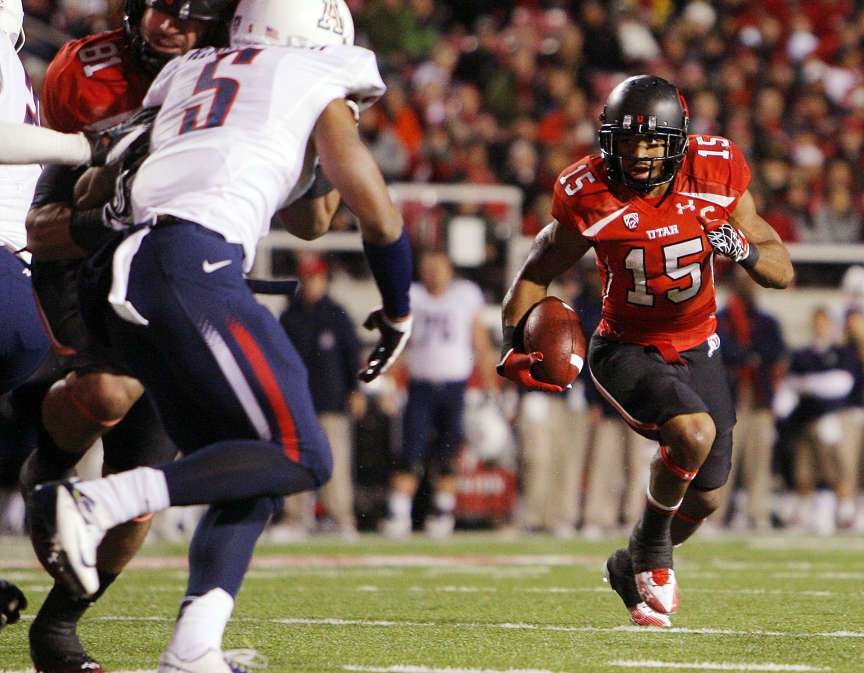 John White runs around the edge against Arizona (Scott G Winterton, Deseret News)