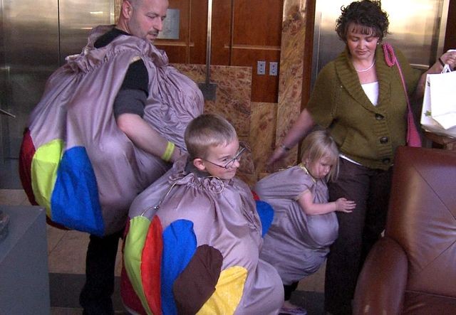 Dov Siporin and his family show off their colorful tail feathers right before heading upstairs to surprise fellow cancer patients at Huntsman Cancer Institute.