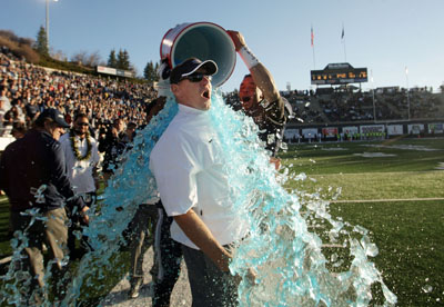 Coach Gary Andersen getting a bath as the Aggies celebrate their WAC championship and their winningest season ever.