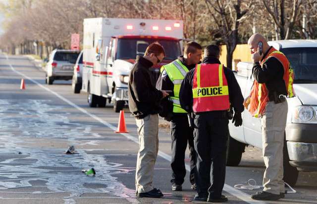 Police investigate the auto pedestrian accident at 9800 S. and 4000 W. in South Jordan Wednesday, Nov. 28, 2012. Elk Ridge Middle School teacher Randy Treglown was hit and killed while jogging near his home and school. (Jeffrey D. Allred, Deseret News)