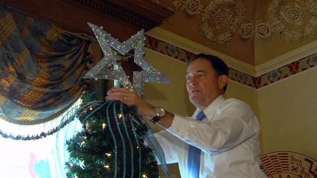 Students help Gov. Herbert decorate the mansion's Christmas tree