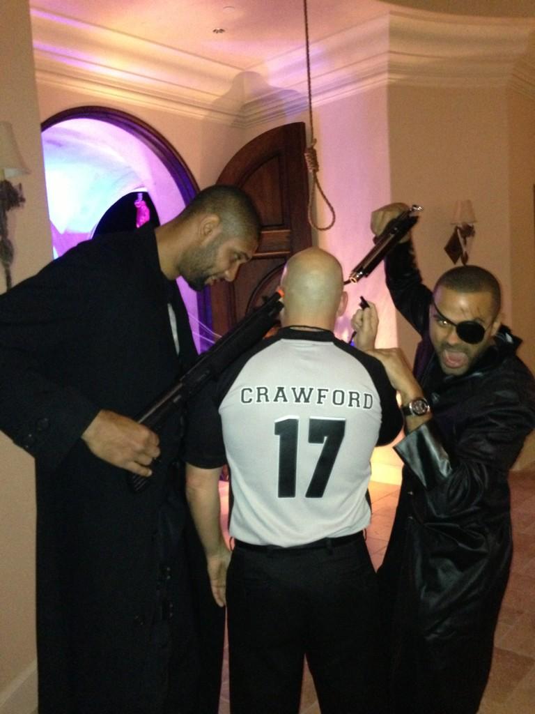 Tim Duncan and Tony Parker dressed up for some party while they are threatening someone dressed up as Joey Crawford.