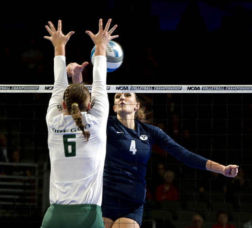 BYU's Kathryn LeCheminant, right, tries to hit the ball past Oregon's Liz Brenner during regional semifinal action. (Associated Press)