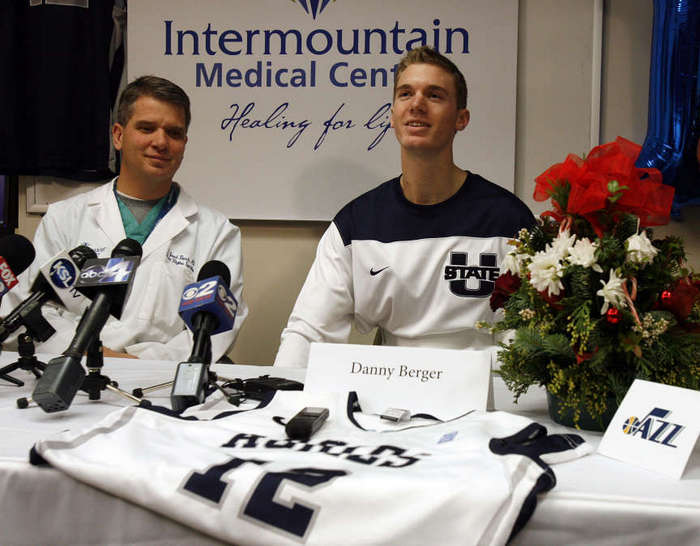Utah State basketball player Danny Berger speaks with the press as he continues recovery at Intermountain Medical Center in Murray, Friday, Dec. 7, 2012. At left is Dr. Jared Bunch of the Intermountain Medical Center Heart Institute. (Photo: Deseret News archives)