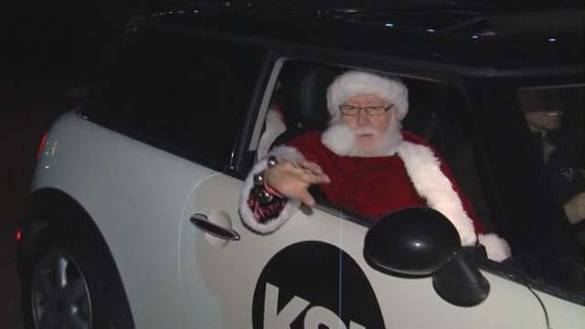 Santa Claus arrives at the annual ZooLights! celebration.