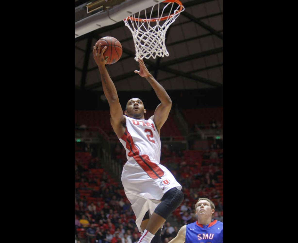 Utah's Aaron Dotson drives to the hoop (Scott G Winterton, Deseret News)