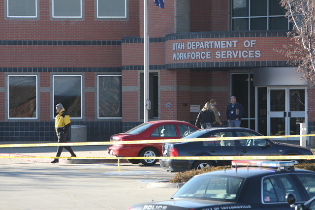 Officials investigate at the scene of a shooting in the parking lot of the Utah Department of Workforce Services in Taylorsville, Thursday, Dec. 20, 2012. (Photo: Ravell Call, Deseret News)