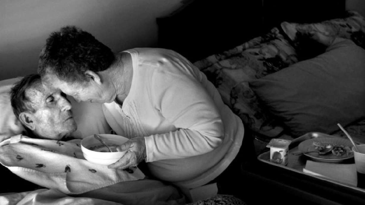 Jolean Sloan feeds her husband breakfast on Feb. 16, 2012. Sloan took care of her husband as long as she could but then turned to hospice care when Richard became bedridden.