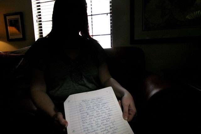 C.A., the adoptive mother of one of Michele Juan Napolitano's children, holds a copy of the letter her daughter read during Napolitano's Dec. 18. 2012, parole hearing. The parole board has decided that Napolitano, who abused one of her children so badly that doctor's had to amputate parts of his feet, will stay in prison until her sentence expires on June 4, 2030. (Geoff Liesik, Desret News)
