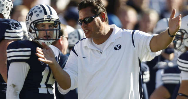 BYU offensive coordinator Robert Anae chats with quarterback Max Hall in October 2008. (Mike Terry, Deseret News)