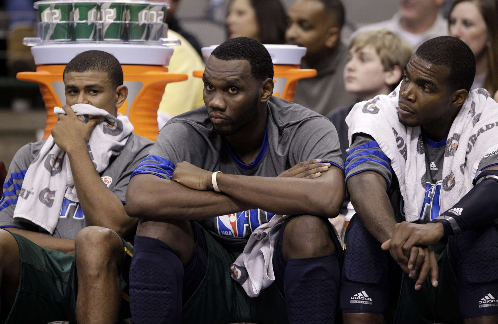 From left to right, Utah Jazz's Earl Watson, Al Jefferson and Paul Millsap sit on the bench (AP Photo/Tony Gutierrez)