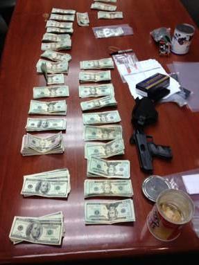 Traffic stop nets guns, drugs, $6k and two arrests