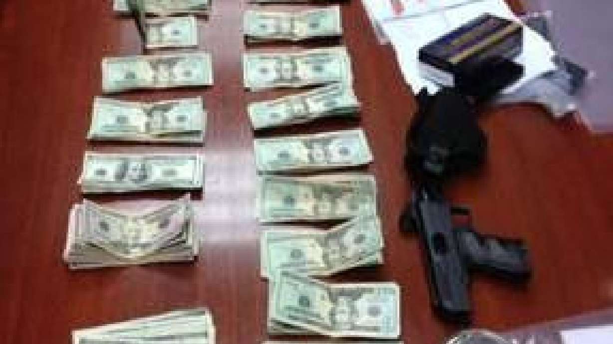 Traffic stop nets guns, drugs, $6k and two arrests