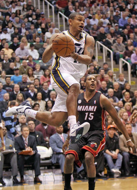 Utah Jazz point guard Earl Watson (11) flies past Miami Heat point guard Mario Chalmers (15) (Tom Smart, Deseret News)