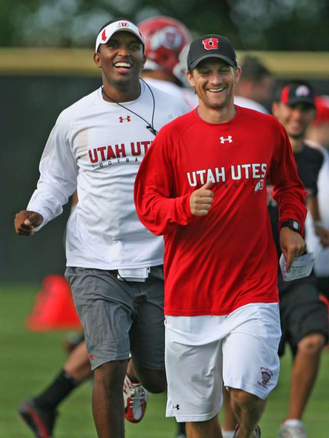 Aaron Roderick, WR coach, right, and QB coach, Brian Johnson, laugh during a Utah football practice at the University of Utah. August 14, 2010. (Michael Brandy, Deseret News)