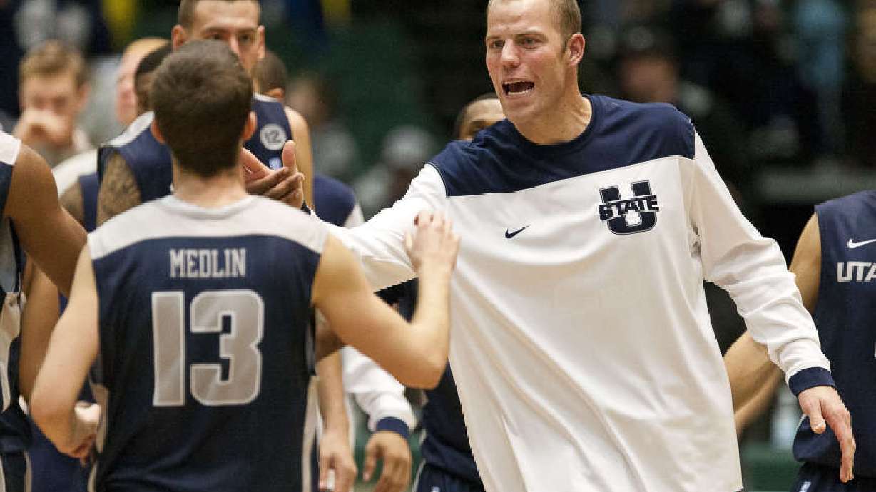 Olson scores 18, Denver downs Utah State 68-57