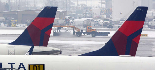 The family of a woman who was killed after her husband hit her in the parking garage at the Salt Lake City International Airport has filed a lawsuit against Delta Air Lines, saying it should have done something about the husband's intoxication. 