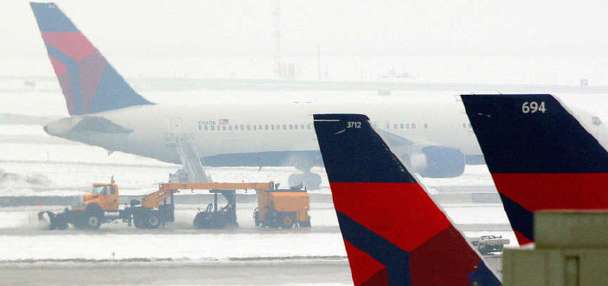 Parents of man who died after climbing into plane's engine sue Salt Lake City