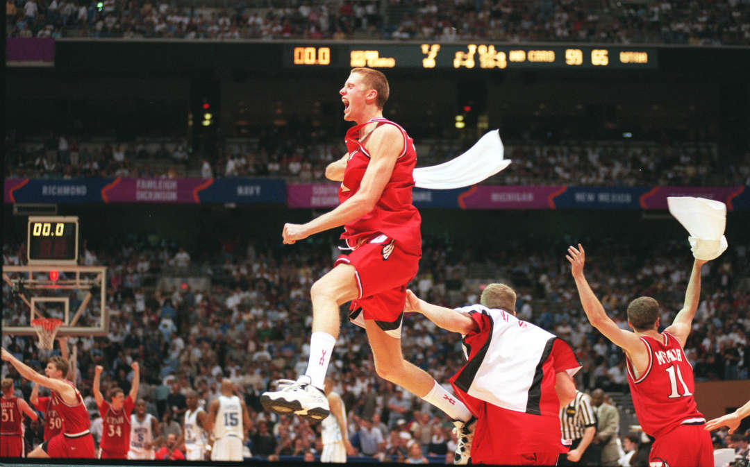 Utah's Britton Johnsen celebrates with his teammates following semifinal win in the Final Four in San Antonio, March 1998. (Ravell Call, Deseret News)