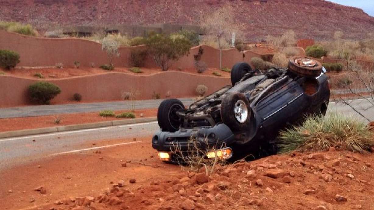 Woman uninjured after car flips over median in St. George